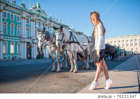 Little girl visiting the Hermitage in Saint-Petersburg. 70211347