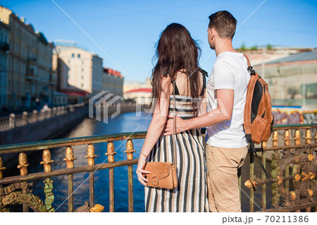 Coulpe at the summer waterfront in Saint Petersburg 70211386