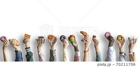 People are holding different desserts in their hands. The concept of food and sweets. 70211706
