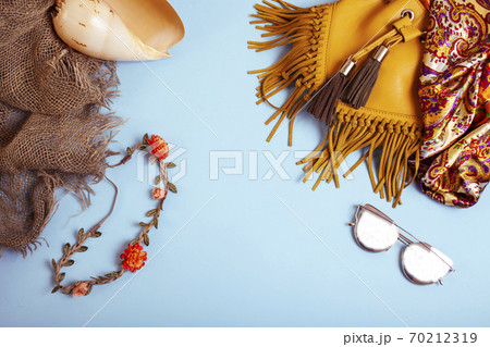 diverse travel girlish stuff on colorful background blue and yellow, nobody tourism lifestyle concept diverse travel girlish stuff on colorful background blue and yellow, nobody tourism lifestyle concept 70212319