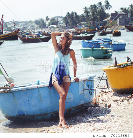 cute smiling young real woman in asian country sea port, vietnam traveller lifestyle cute smiling young real woman in asian country sea port, vietnam traveller lifestyle 70212362