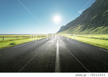 sunny road in summer Iceland 70212431