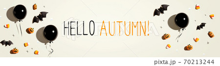 Hello autumn message with balloons and Halloween decorations 70213244
