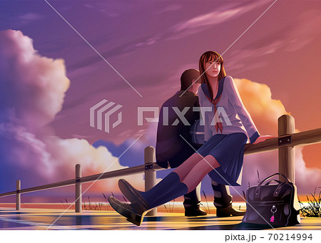 oung Japanese students relax together at the harbor 70214994