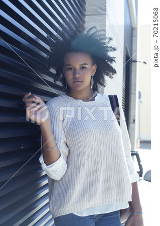 young pretty african girl posing cheerful on city background, lifestyle outdoor people concept young pretty african girl posing cheerful on city background, lifestyle outdoor people concept 70215068