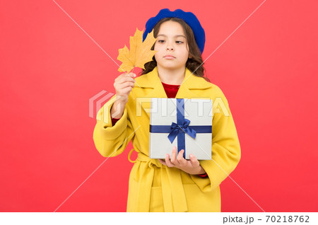 thanksgiving day. girl child in french beret hold gift thanksgiving day. girl child in french beret hold gift 70218762
