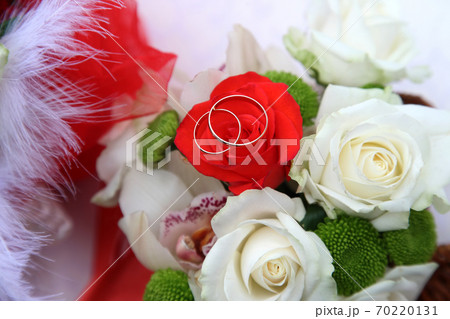 Wedding rings on bride's bouquet 70220131