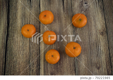 Tangerine, Mandarin honey orange on the wooden background. Food concept. Tangerine, Mandarin honey orange on the wooden background. Food concept. 70221985