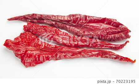 Dried hot red pepper on a white background. Food and spices. 70223195
