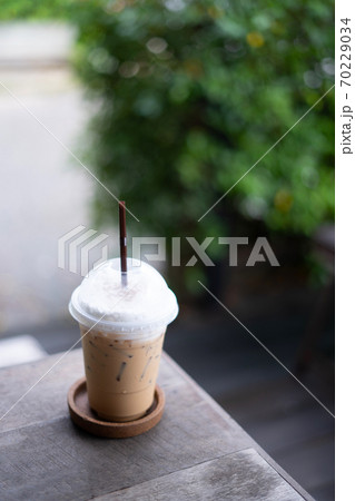 coffee on the wooden table from above. Urban coffee shop workspace or coffee break in morning. coffee on the wooden table from above. Urban coffee shop workspace or coffee break in morning. 70229034