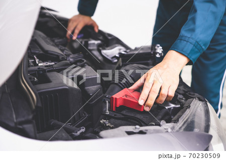 Professional mechanic hand providing car repair and maintenance service 70230509