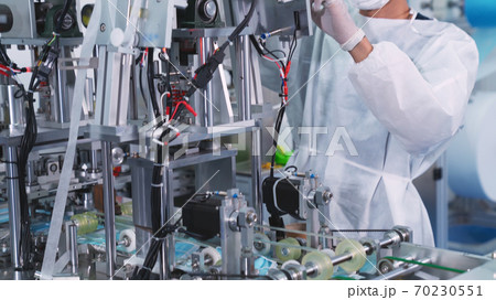 Face mask production line in modern factory Face mask production line in modern factory 70230551