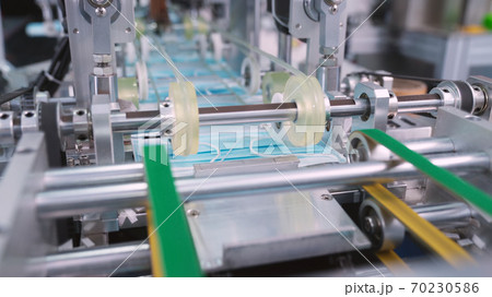 Face mask production line in modern factory Face mask production line in modern factory 70230586