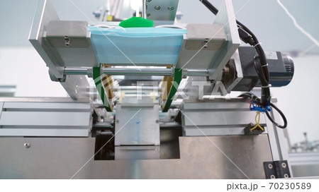 Face mask production line in modern factory 70230589
