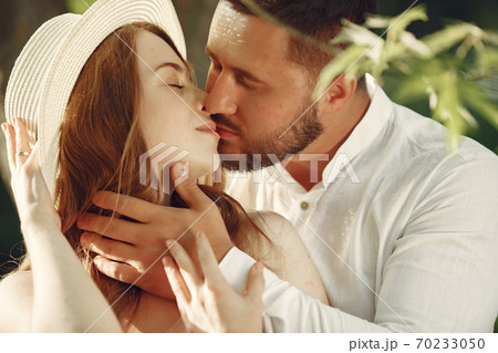 Beautiful couple spend time on a summer field 70233050