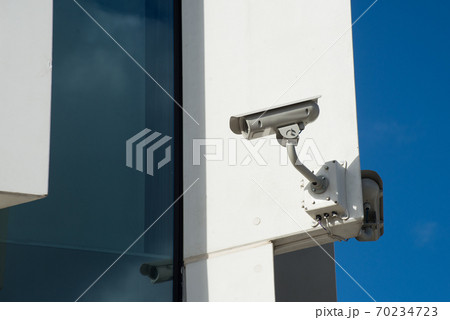 Closeup of security camera on modern building facade 70234723