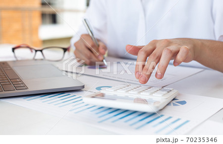 Accounting businessmen are calculating income-expenditure and analyzing real estate investment data, Financial and tax systems concept. 70235346