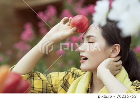 Beautiful female farmer resting Beautiful female farmer resting 70235755