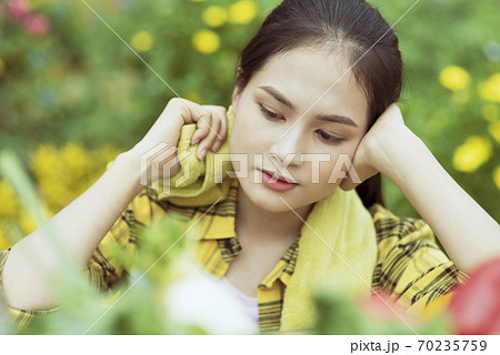 Beautiful female farmer resting 70235759