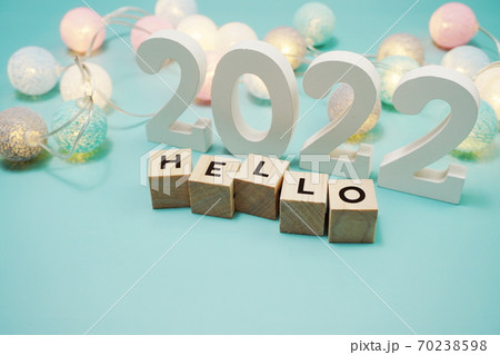 Hello 2022 alphabet letters with space copy on blue background Hello 2022 alphabet letters with space copy on blue background 70238598