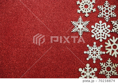 wooden snowflake border frame on red glitter background 70238874
