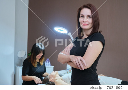 Portrait of confident female specialist in spa beauty salon 70246094