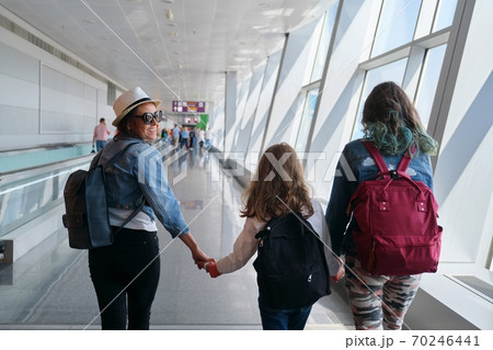 Airport terminal inside, walking people passengers with luggage Airport terminal inside, walking people passengers with luggage 70246441