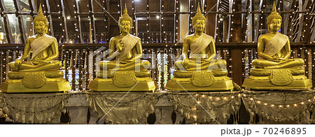 Row of Four Golden Buddha Statues Sitting on Pillows in Seema Malaka Temple Row of Four Golden Buddha Statues Sitting on Pillows in Seema Malaka Temple 70246895