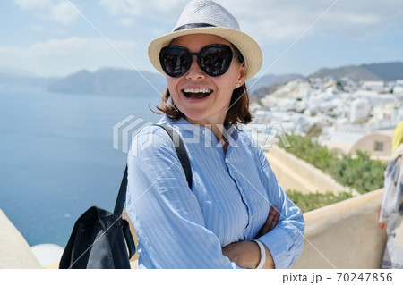 Happy smiling woman tourist traveling on luxury cruise, Greece, Santorini Happy smiling woman tourist traveling on luxury cruise, Greece, Santorini 70247856