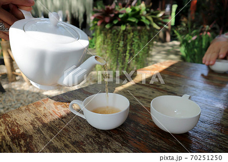 tea cup and tea pot on the table tea cup and tea pot on the table 70251250