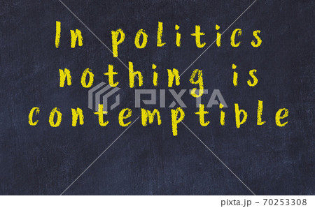 Chalk inscription of smart quote on black desk 70253308