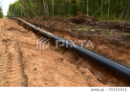 Trench in ground for laying pipeline of natural gas. Trench in ground for laying pipeline of natural gas. 70253423
