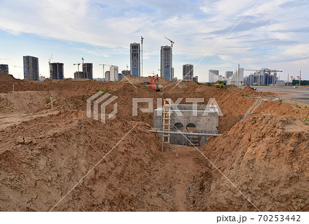 Trench for laying sewer pipes an external sewage system at a construction site.  70253442