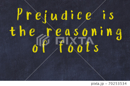 Chalk inscription of smart quote on black desk Chalk inscription of smart quote on black desk 70253534