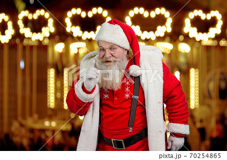 Santa Claus gesturing with index finger. 70254865