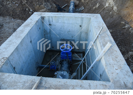 Resilient Seated Gate Valves connect pipeline of water supply in concrete bunker at constructin site 70255647
