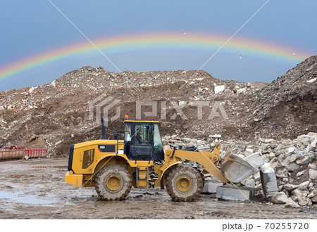 Wheel loader at landfill for disposal of construction waste. 70255720
