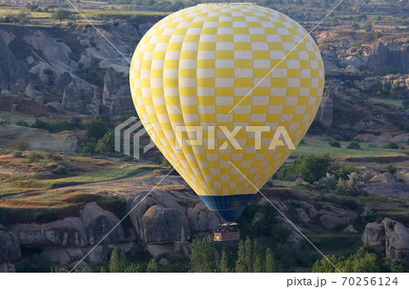 balloon is flying in mountainous area in Cappadocia. Turkey 70256124