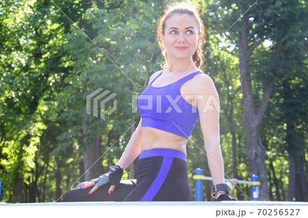 beautiful sporty girl resting after exercise 70256527