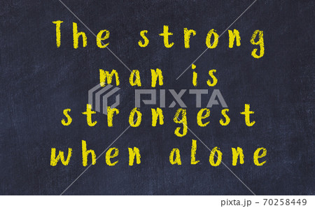 Black chalkboard with wise inscription on it Black chalkboard with wise inscription on it 70258449