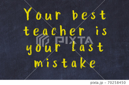 Black chalkboard with wise inscription on it 70258450