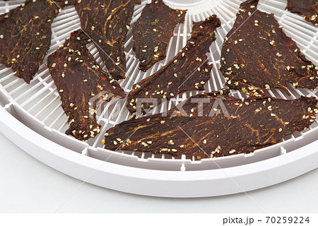 dried beef slices in spices with sesame seeds dried beef slices in spices with sesame seeds 70259224