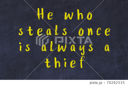 Chalk inscription of smart quote on black desk Chalk inscription of smart quote on black desk 70262535