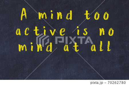 Chalk inscription of smart quote on black desk 70262780