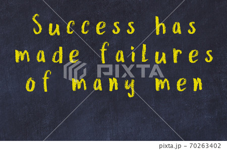 Chalk inscription of smart quote on black desk Chalk inscription of smart quote on black desk 70263402