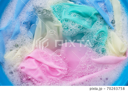 Color clothes soak in powder detergent water dissolution. Laundry concept 70263758