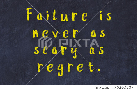 Chalk wise inscription on black chalkboard 70263907