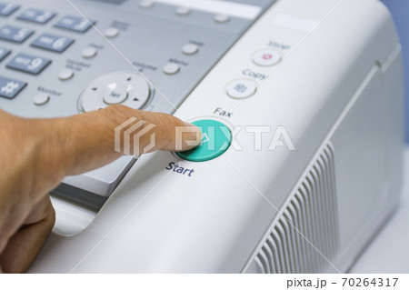 hand man are using a fax machine in the office, equipment for data transmission. hand man are using a fax machine in the office, equipment for data transmission. 70264317