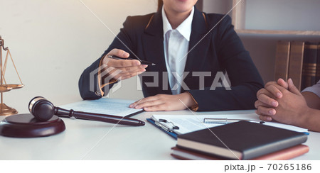 Business lawyer is currently counseling the client's trial at the lawyer office. 70265186