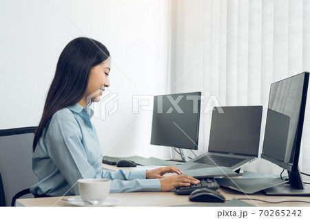 Asian young female programmer working developer programing on a computer code at office. 70265242